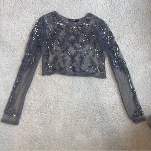 Sheer long sleeve top with intricate design